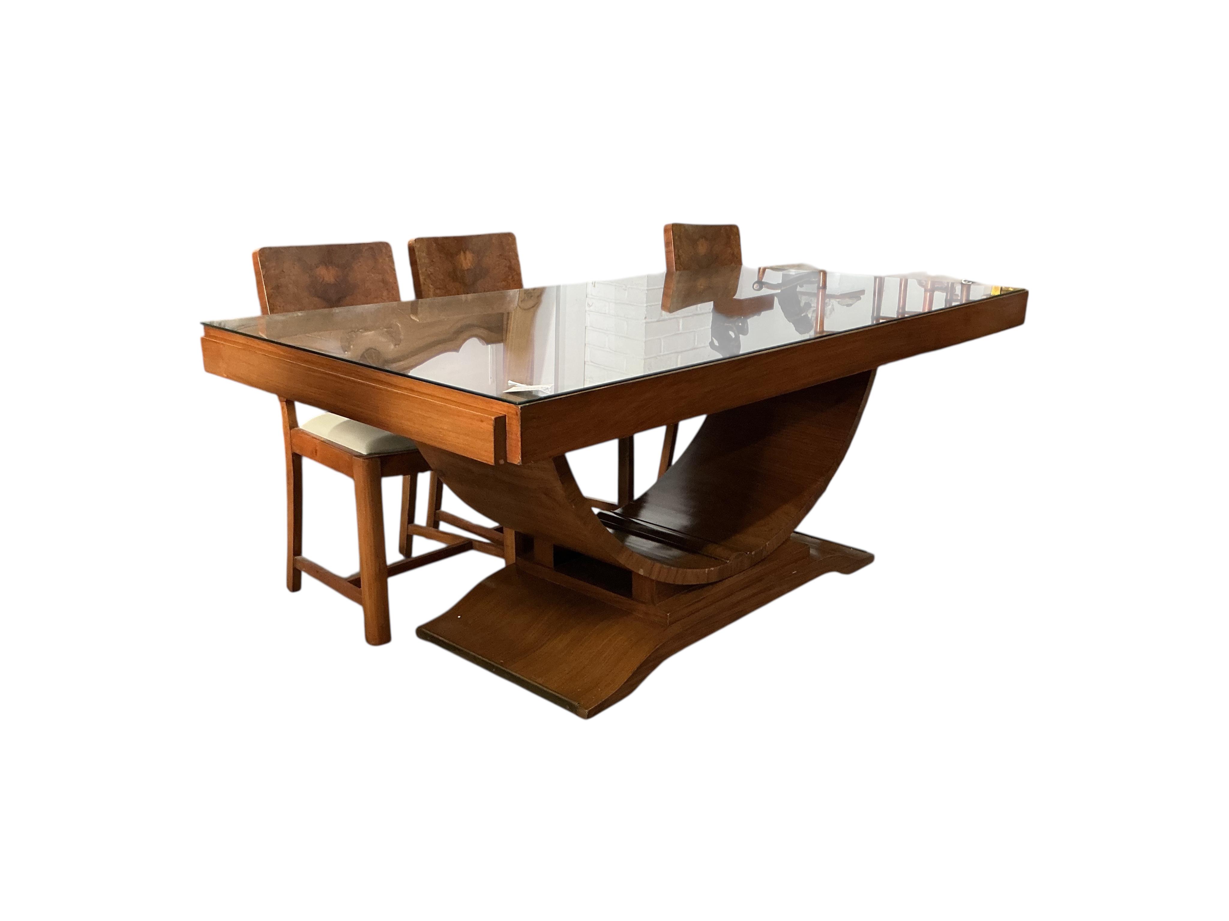 An Art Deco style rectangular walnut dining table, width 180cm, depth 94cm, height 75cm and six chairs